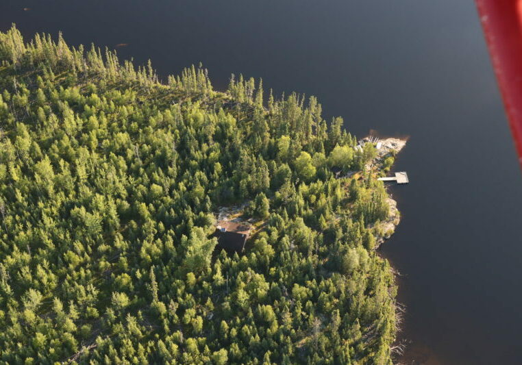 Aerial shot of outpost camp and forest